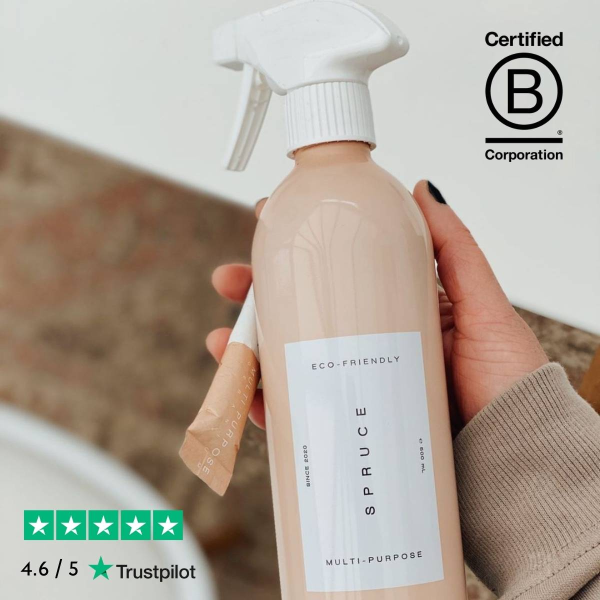 hand holding all purpose cleaner and refill