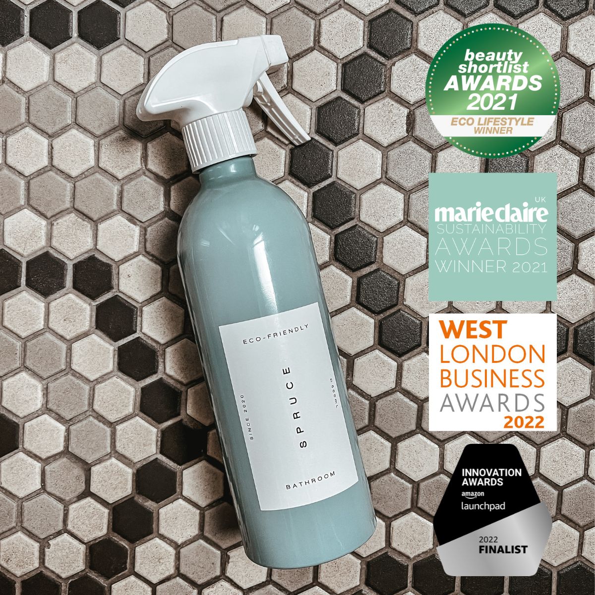a tile cleaner spray on a tiled floor with award logos