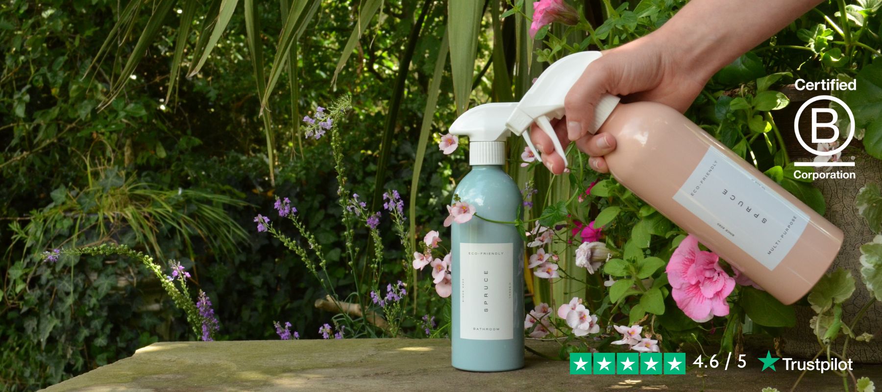 Hand spraying natural cleaning products outside
